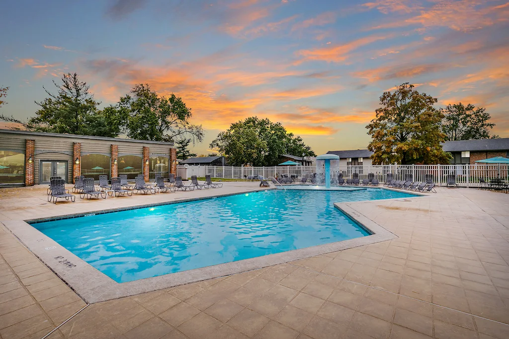 Cypress Village refreshing swimming pool with lounge chairs at dusk