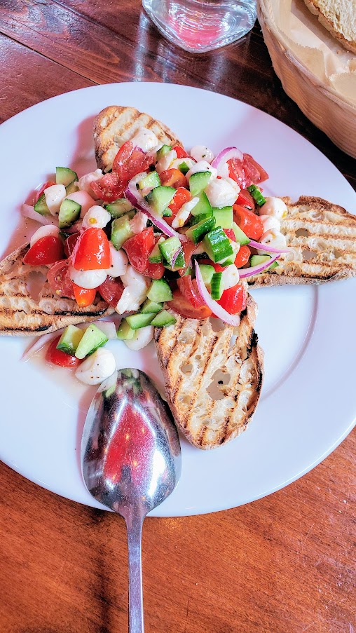 Bruschetta di Panzanella with grilled ciabatta with tomatoes, cucumber, basil, mozzarella and onion, Maccheroni Republic in downtown LA offering homemade fresh organic pasta