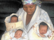 GLAD:  Rebecca Phejane  with  her newborn triplets at her home at Setlopo village. Photo: Boitumelo Tshehle