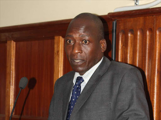 A Police officer at Mlolongo Police station Richard Nyakundi testifies at the Milimani law court on Thursday,March 30 on the ongoing inquiry into the killing of laywer Willy Kimani his client and a taxi driver. PHOTO/COLLINS KWEYU