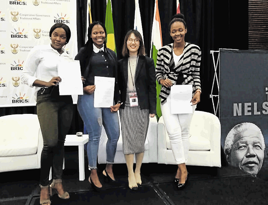 Sinovuyo Nomandla, right, Yanga Mangisa, left, and Khuselwa Kilani with Xu Shufang of Homestay