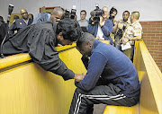 Truck driver Sanele Goodness May and his lawyer, Theasan Pillay, at May's appearance in the Pinetown Magistrate's Court. File photo