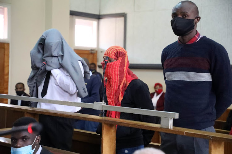 Simon Scorpion Ndyalvane, Caylene Whiteboy and Forster Netshiongolo appearing in the Protea magistrate’s court in Soweto during their earlier appearance.