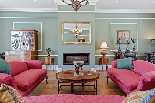 Living room with pink sofas and fireplace - House purchase in Havant, 5 bedrooms