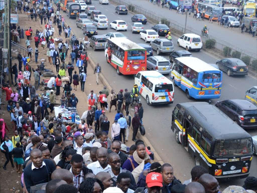 Kenyans walk after the ban of matatus from the CBD took effect on Monday, December 3, 2018. /JULIUS OTIENO