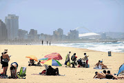 BURNING ISSUE: Holidaymakers relax on uShaka Beach, Durban