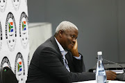 Former MEC of economic development in the Free State, Mxolisi Dukwana, smiles during a break at the state capture commission on Friday, April 5 2019.