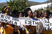 Maidens holding up placards to welcome amaZulu King Misuzulu KaBhekuzulu.