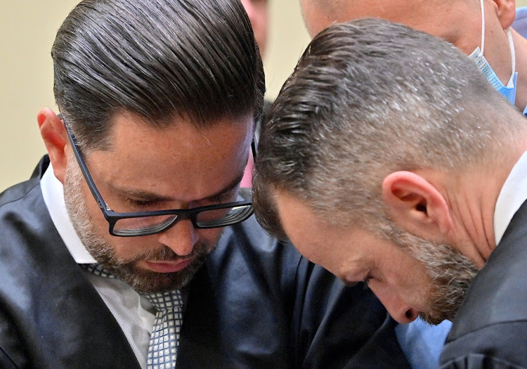 Lawyers Yuri Goldstein and Alexander Dann talk before Dr Mark S trial in a courtroom in Munich, Germany, yesterday