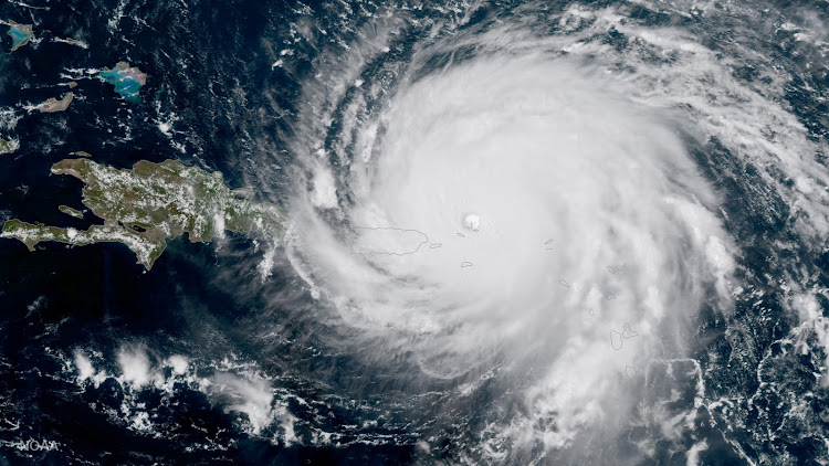 Hurricane Irma, a record Category 5 storm, is seen approaching Puerto Rico in this NASA's GOES-16 satellite image taken at about 15:15 EDT on September 6, 2017.