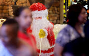 People walk past the Christmas display at Monte Casino in Fourways. 