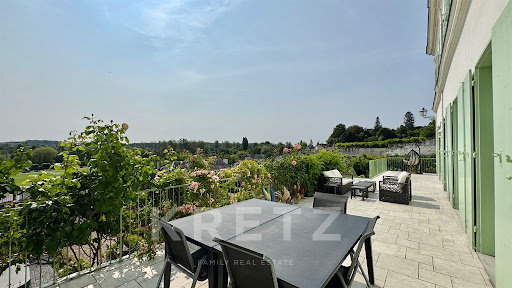 Terrace with outdoor furniture and view in this luxury house for sale in Loches ($1,230,918 - 430 m²)