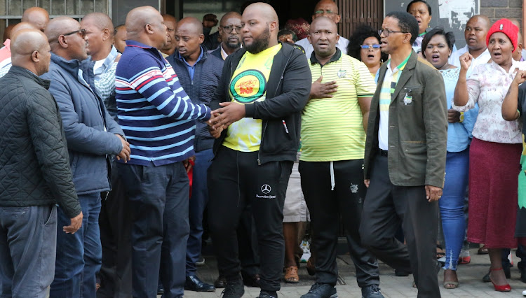 SEARING LOSS: Shocked ANC members gather outside Florence Matomela House in Govan Mbeki Avenue on Monday after word spread that Bicks Ndoni had died