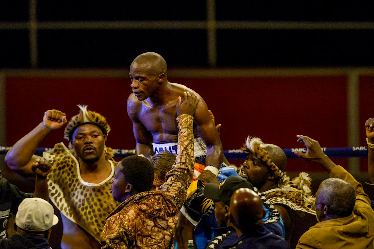 Moruti Mthalane is hoisted high as he wins by TKO against Genesis Libranza during the Boxing from Wembley Arena on April 28, 2017.