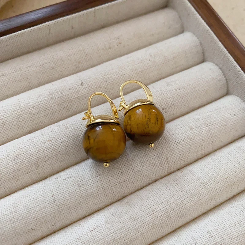 Silver Needle Coffee Color Series Love Oval Earrings. Enhance your natural beauty and style with these elegant and timel