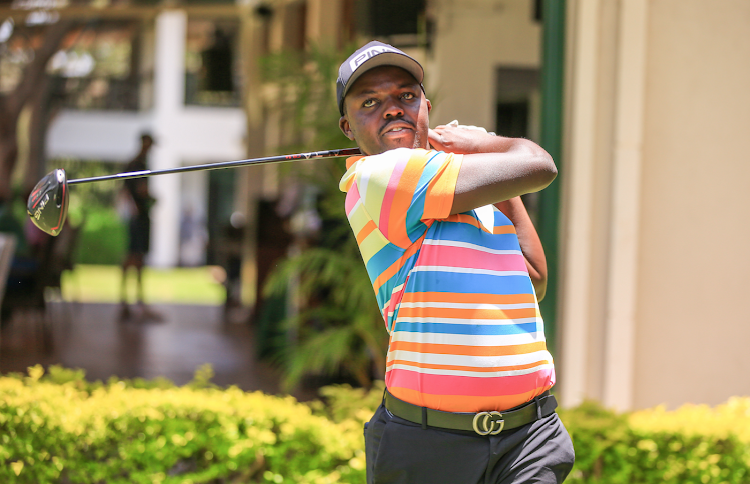 Edwin Mudanyi follows his tee during the Savannah Tour golf tournament at Muthaiga Golf Club.jpg