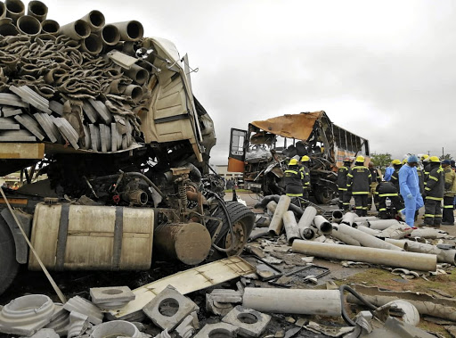 Emergency staff survey the scene of the wreckage after a crash that claimed three lives./Isaac Mahlangu