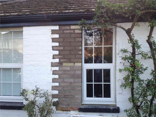 The left section of the unit has been bricked up and the right section replaced to match a new partition wall inside the house