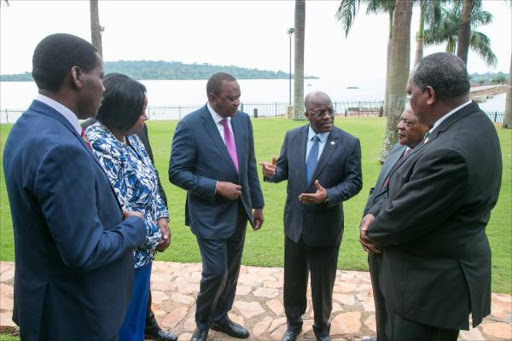 Presidents Uhuru Kenyatta and John Magufuli (Tanzania) in Uganda where they and other leaders attended the East African Community Summit, February 23, 2018. /