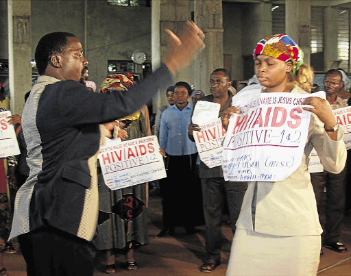 FAITH HEALER: Prophet TB Joshua in action. Sixty seven South Africans died while visiting Joshua's church in Nigeria.