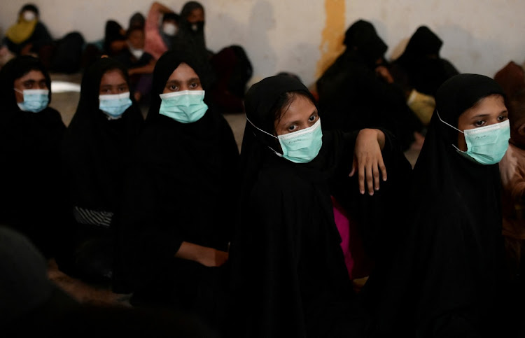 Rohingya women sit inside a temporary shelter after they arrived in Aceh, Indonesia, November 14 2023. Picture: RISKA MUNAWARAH/REUTERS