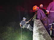 Rescuers had to abseil 30 metres down into a valley to rescue a woman, who was allegedly thrown off a bridge in Durban