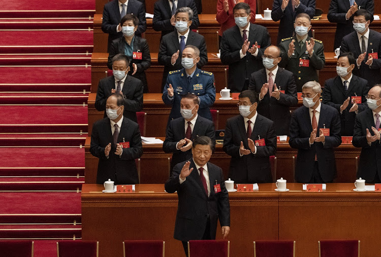 Chinese President Xi Jinping, front centre, is applauded as he arrives at the 20th National Congress of the Communist Party of China at The Great Hall of People in Beijing, China, October 16 2022. Picture: KEVIN FRAYER/GETTY IMAGES