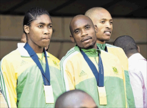 WORLD BEATERS: Former world 800m women's and men's champions Caster SemenyaMbulaeni Mulaudzi and long jump silver medallist Khotso Mokoena. PHOTO: Tyrone Arthur/ Business Day