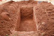 Police uncover a grave containing at least 200 bodies.