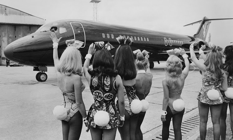 Playboy Magazine bunnies at London airport with the Playboy jet “Big Bunny”.