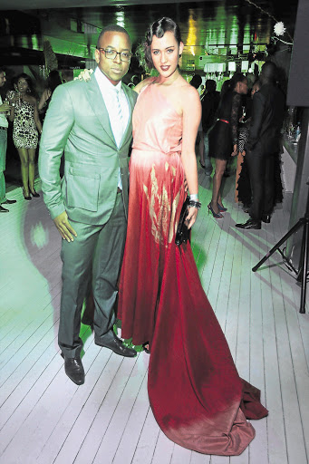 GIVING THE LEGS A REST: Isidingo actress Jay Anstey and and model 'Maps' Maponyane at the fashion week launch