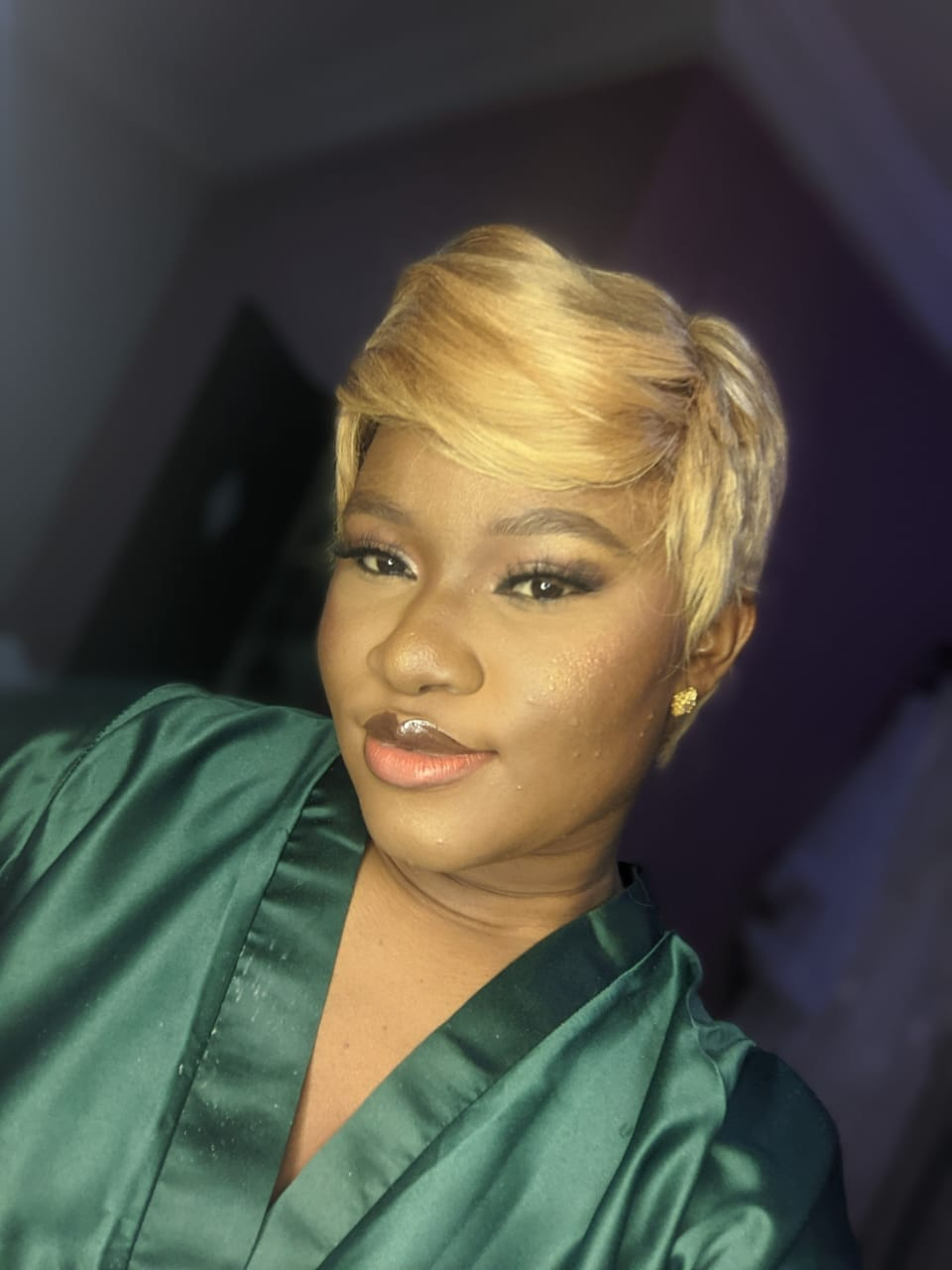 Victoria Willie wearing blond pixie cut 