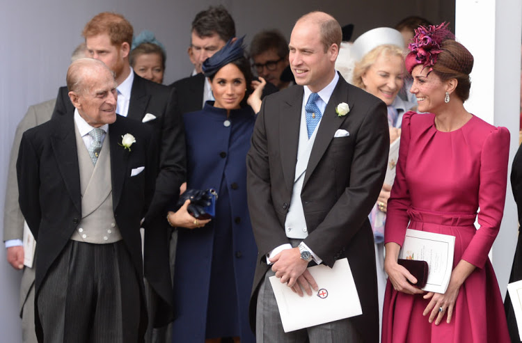 Prince Philip, Duke of Edinburgh, Meghan, Duchess of Sussex, Prince William, Duke of Cambridge and Catherine, Duchess of Cambridge attend the wedding of Princess Eugenie of York and Jack Brooksbank at St George's Chapel in Windsor Castle on October 12 2018 in Windsor, England.