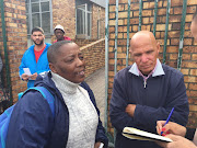 Community leader Joanie Fredericks and Sedick Abrahams, who stands accused of killing his drug addict son, outside the Mitchells Plain Magistrate’s Court in Cape Town on Tuesday.