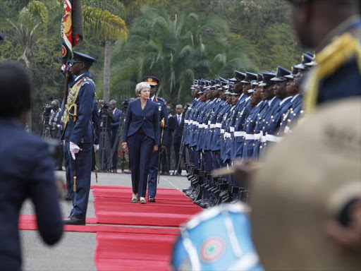 British PM Theresa May inspects a guard of honour mounted at State House, Nairobi on Thursday, August 30, 2018. /MONICAH MWANGI