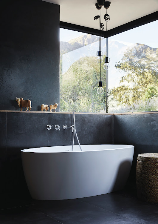 The “winter” bedroom is positioned to catch the morning sun during the cold months. The “winter” bathroom, like the bedroom, features a darker variation on the palette of greys and neutral tones.