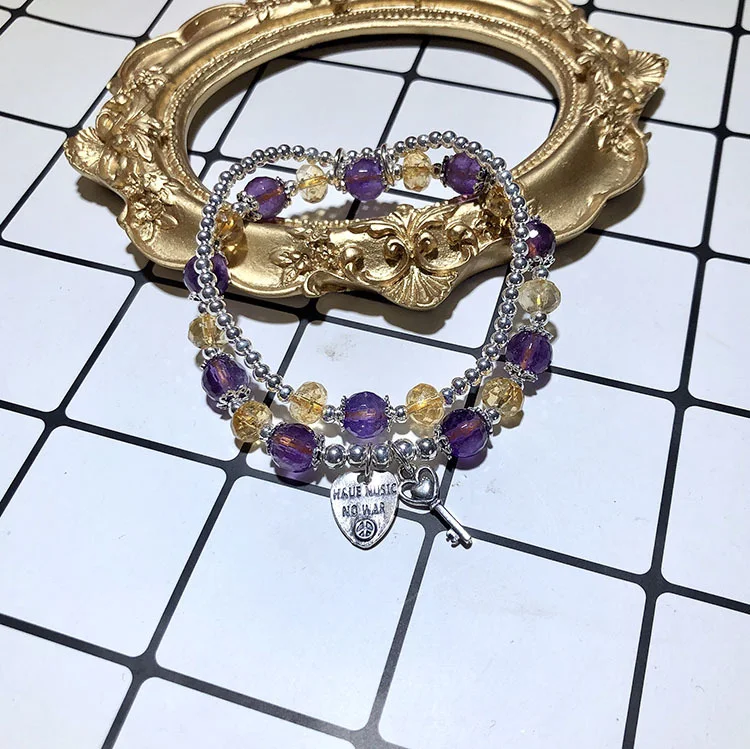Citrien-Amethist dubbellaagse armband, voor harmonie en balans. Ervaar de krachtige combinatie van citrien en amethist in een elegant ontwerp.