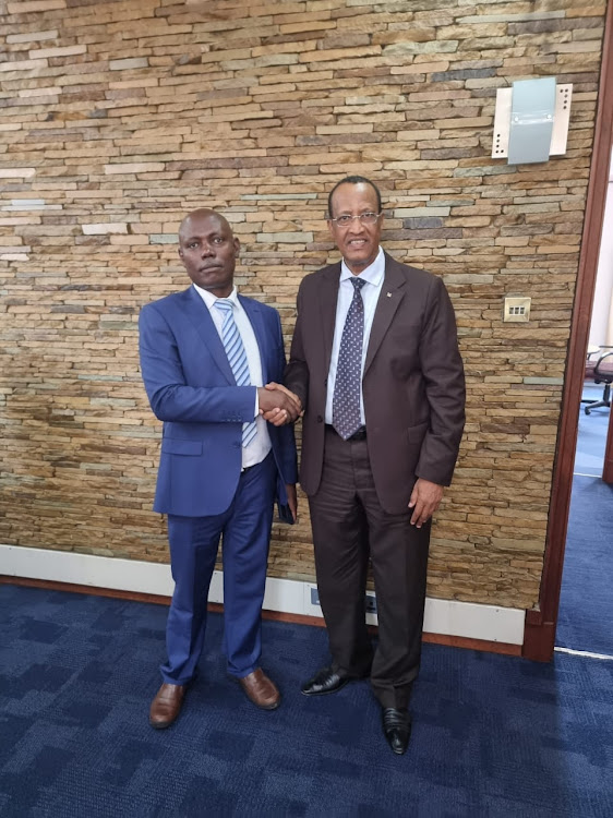 KPLC managing director Geoffrey Muli and Garissa governor-elect Nathif Jama during a meeting to restore power at the Garissa Water and Sewerage Company on Thursday, August 18.