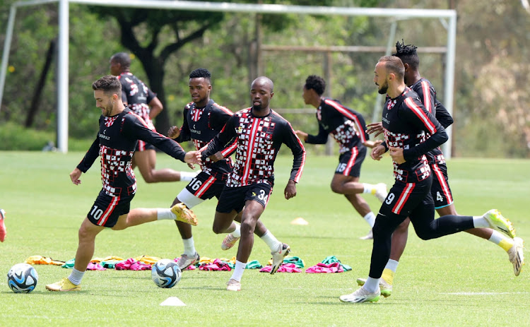 Samir Nurkovic (right) closes in on his TS Galaxy teammates during training at Sturrock Park in Johannesburg on Wednesday