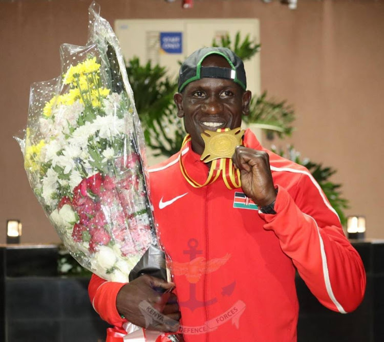 Kenya Air Force Seargent Edwin Okong'o displays his gold medal won at the 13th All African Games.