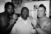 HEAVY HITTERS: Promoter Dingaan Thobela is flanked by Bully Muravha, left, and Basil Ray during a media briefing before their fight at Emperors Palace in Ekurhuleni on July 29. Photo. Antonio Muchave. 03/07/08. © Sowetan.