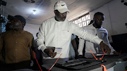 Leader of Liberia's ruling party Coalition for Democratic Change(CDC), President and former soccer player George Weah, prepares to cast his vote during the presidential elections in Monrovia, Liberia  October 10, 2023. 