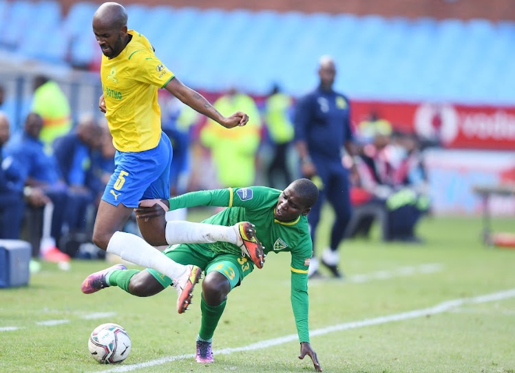 Mosa Lebusa of Mamelodi Sundowns and Michael Gumede of Golden Arrows during the DStv Premiership match between Mamelodi Sundowns and Golden Arrows at Loftus Versfeld Stadium.