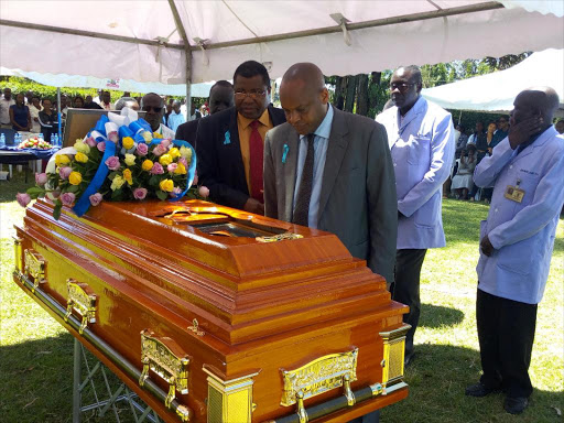 MTRH CEO Wilson Aruasa and his deputy Francis Ogaro view the body of Boustros Mbugua who was murdered last Sunday in Eldoret, November 15, 2017. /MATHEWS NDANYI