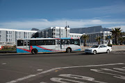 Bus passing hotel below Table Mountain in Cape Town. File Photo