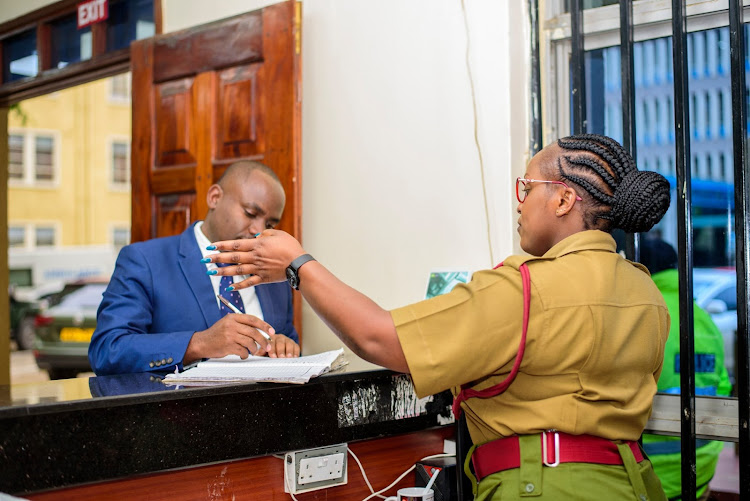 NPS CPL Christime Mugambi helping a customer