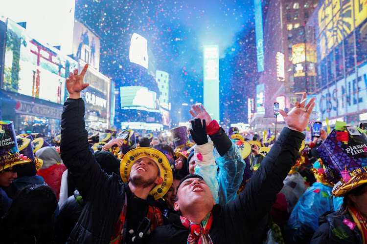 People celebrate as confetti flies around the countdown clock during the first public New Year's event since the coronavirus disease (COVID-19) pandemic, at Times Square, in the Manhattan borough of New York City, New York, U.S., January 1, 2023.