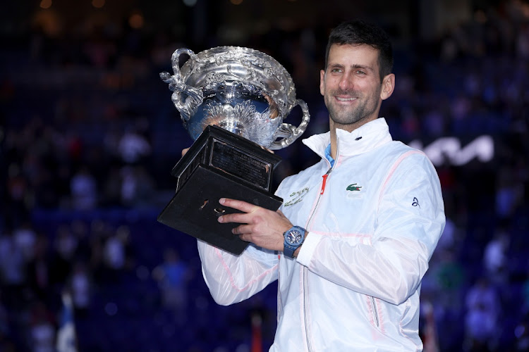 Novak Djokovic of Serbia poses for photographs with the Norman Brookes Challenge Cup after winning against Stefanos Tsitsipas of Greece at the 2023 Australian Open at Melbourne Park in Melbourne, Australia, January 29 2023. Picture: CLIVE BRUNSKILL/GETTY IMAGES