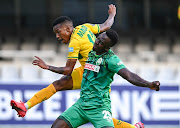 Limbikani Mzava of AmaZulu FC is to late to prevent Pule Mmodi of Lamontville Golden Arrows taking a shot at goal during the DStv Premiership match between Amazulu and Golden Arrows at Jonsson Kings Park stadium on December 16, 2020 in Durban, South Africa. 