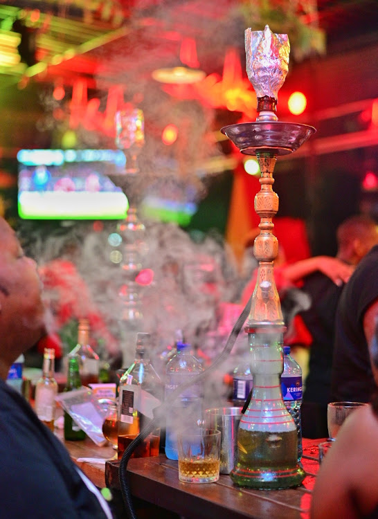 Shisha pots are seen in use at a nightclub in Nairobi